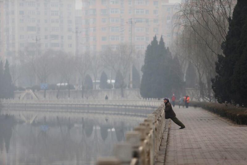 A man does exercises in haze-covered Beijing on February 24. On Tuesday, China suffered a sixth consecutive day of severe air pollution. China Out/AFP Photo