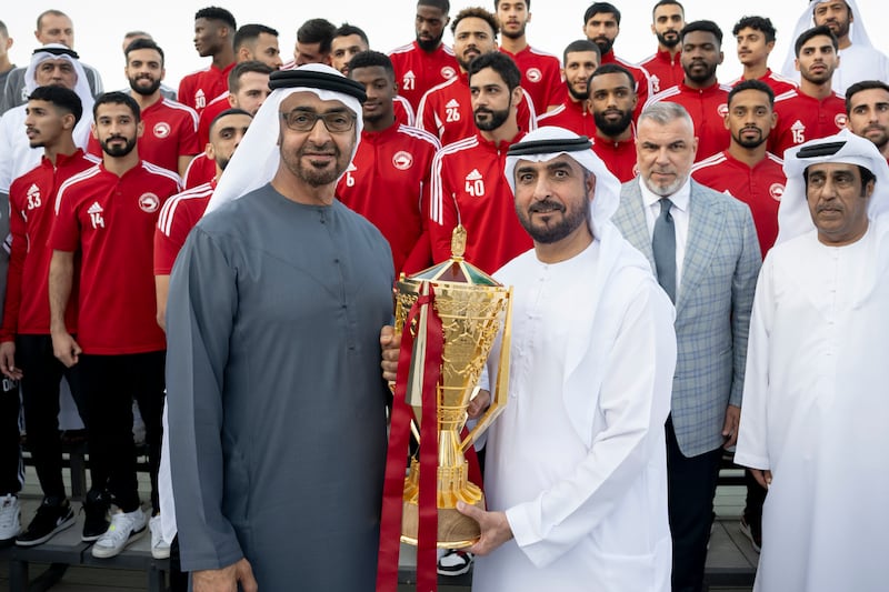President Sheikh Mohamed stands for a photograph with Sharjah Football Club players at the Sea Palace in Abu Dhabi after the local side won the President's Cup. All photos: UAE Presidential Court 