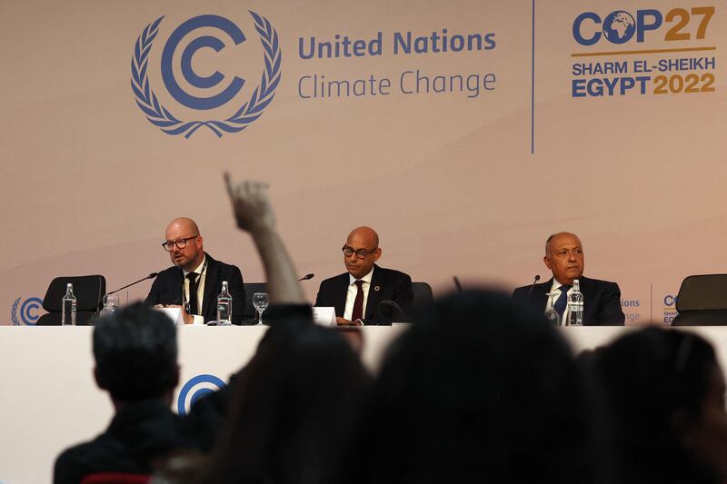 From left to right, the UN's climate change communications officer, Alexander Saier; Simon Stiell, the executive secretary of the UN's Framework Convention on Climate Change; and Cop27 President Sameh Shoukry listen to questions following the opening ceremony. AFP
