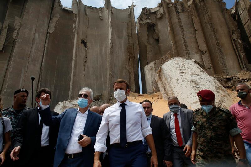 French President Emmanuel Macron visits the devastated site of the explosion at the port of Beirut.  EPA