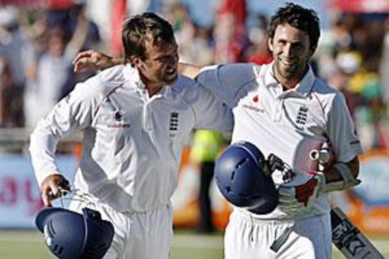 Graham Onions, right, and Graeme Swann helped England to a draw against the South Africans in the Cape Town Test match.