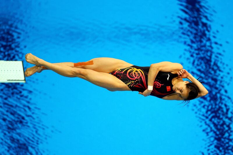 LONDON, ENGLAND - AUGUST 05:  Minxia Wu of China competes in the Women's 3m Springboard final on Day 9 of the London 2012 Olympic Games at the Aquatics Centre on August 5, 2012 in London, England.  (Photo by Al Bello/Getty Images)