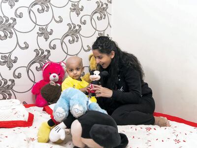 DUBAI, UNITED ARAB EMIRATES. 19 APRIL 2020. 
Aarev Shetty, 2, drinks water in his bed. He just returned from the hospital after receiving his cancer treatmentl. (Photo: Reem Mohammed/The National)

Reporter:
Section: