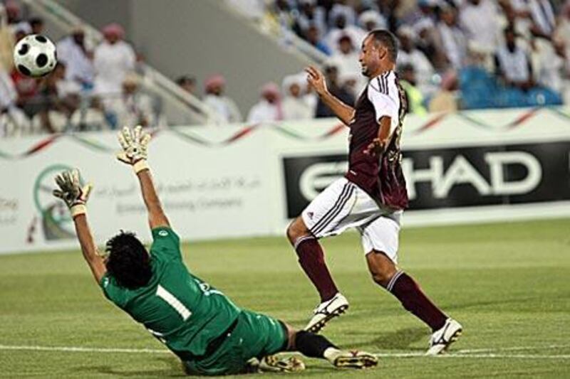 Fernando Baiano, the Brazilian striker, scores Al Wahda's winning goal against Baniyas last night.