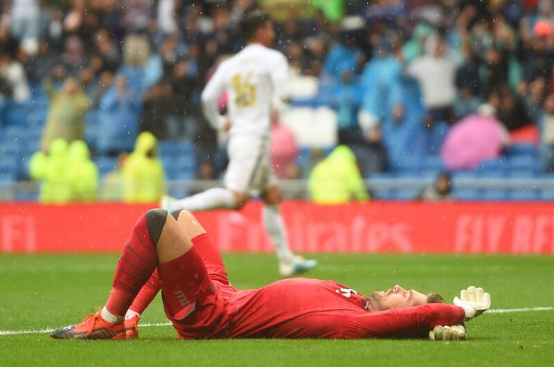 Aitor Fernandez of Levante  reacts to Karim Benzema of Real Madrid scoring. Getty Images