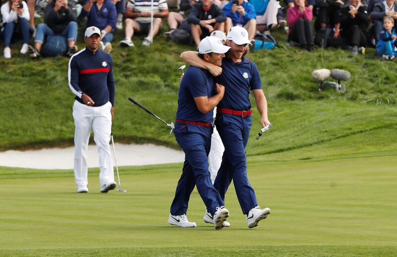 Team Europe's Francesco Molinari and Tommy Fleetwood celebrate during the fourballs. Reuters