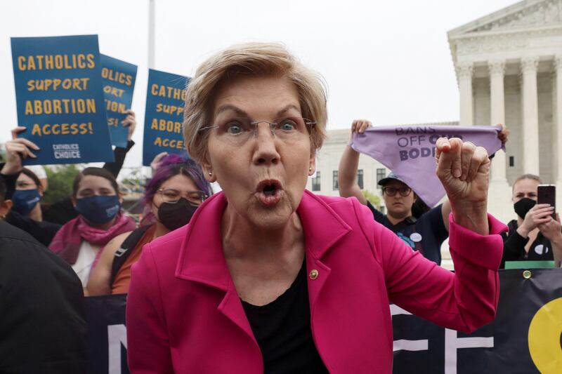 US Senator Elizabeth Warren joins demonstrators during a protest outside the US  Supreme Court. Reuters