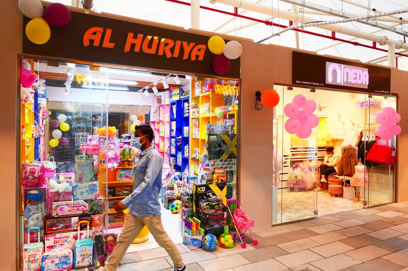 Shops welcome visitors at the Souk Al Marfa.