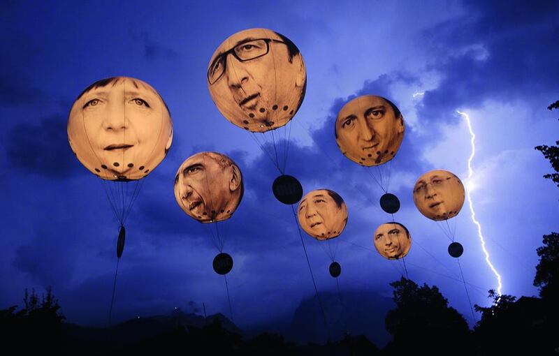 Lightning strikes amid balloons depicting the leaders of the G7 countries before a June meeting in Germany.  Wolfgang Rattay / Reuters / June 7, 2015