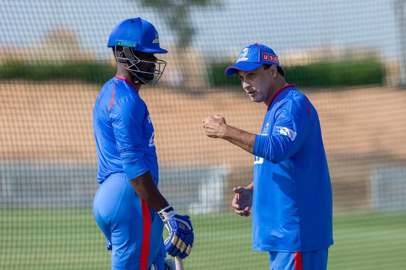 MI Emirates head coach Robin Singh speaks to Andre Fletcher during a practice session for the ILT20 at the Sheikh Zayed Cricket Stadium in Abu Dhabi. R Parthibhan / Focus Sports / MI Emirates