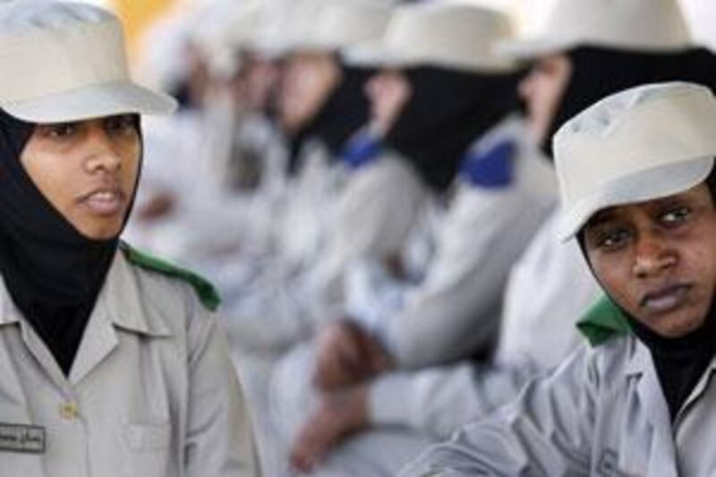 Hanan Mohmmed al Katheeri, left, and Mona Bushra al Awad are cadets at the Police Women Training Section of the Abu Dhabi police.