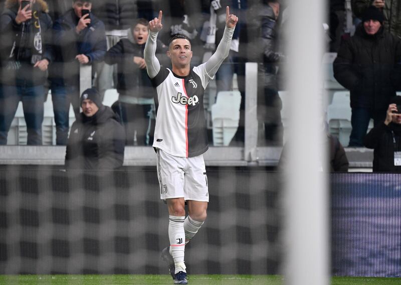 Juventus' Portuguese forward Cristiano Ronaldo celebrates after opening the scoring during the Italian Serie A football match Juventus vs Cagliari on January 6, 2020 at the Juventus Allianz stadium in Turin. (Photo by Marco Bertorello / AFP)