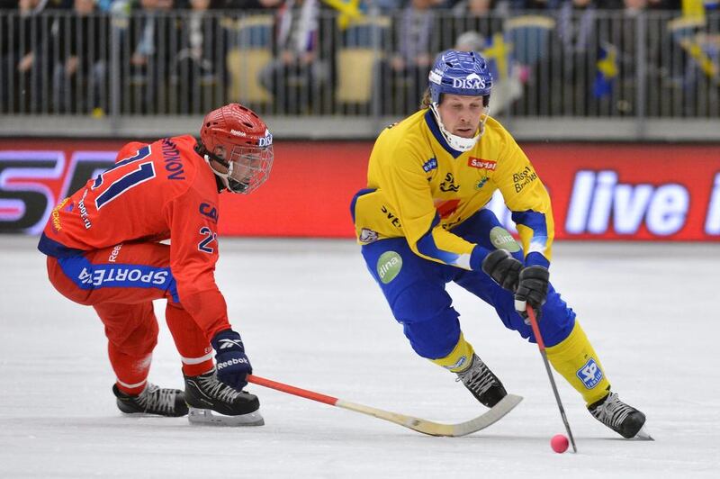 Russia's Igor Larionov, left, and Sweden's Daniel Mossberg in action during the Bandy World Championship final in Vanersborg, Sweden in February 2013. Anders Wiklund / AP 