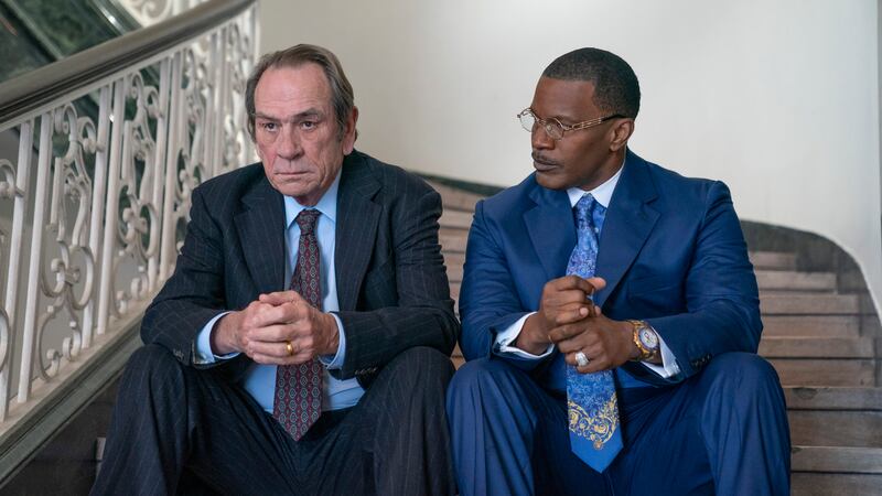 Tommy Lee Jones as Jeremiah O'Keefe, left, and Jamie Foxx as Willie Gary in a scene from The Burial, a film premiering at the Toronto International Film Festival. AP