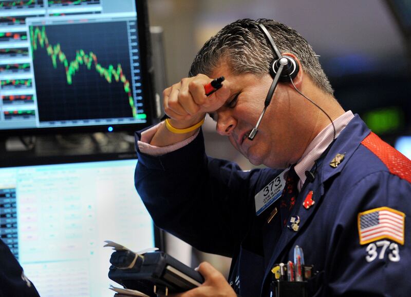 Trader John W. Panin of JNK Securites Corp. works on the floor of the New York Stock Exchange on August 4, 2011. The Dow Jones Industrial Average plunged 4.3 percent Thursday, its worst one-day drop in more than two years, as global markets melted down over fears of another world economic downturn. The Dow was down 512.76 points to 11,383.68; the broader S&P 500 lost 4.8 percent to 1,200.07, while the tech-heavy Nasdaq Composite plunged 5.1 percent to 2,556.39.    TOPSHOTS/AFP PHOTO/Stan HONDA
 *** Local Caption ***  553337-01-08.jpg