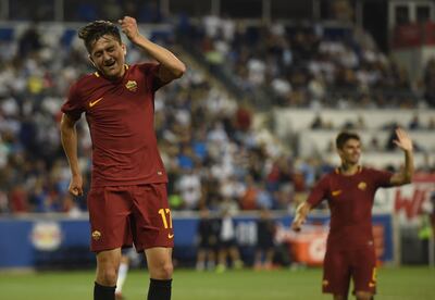 Cengiz Under (L) of A.S. Roma celebrates scoring a goal during their International Champions Cup (ICC) football match against Tottenham Hotspur on July 25, 2017 at Red Bull Arena in Harrison, New Jersey.  / AFP PHOTO / Don EMMERT