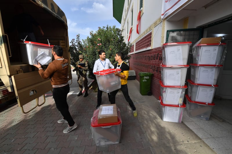 Ballot boxes are loaded into a military lorry, en route to a polling station in the district of Ariana near Tunis. AFP
