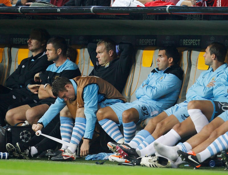 Football - Bayern Munich v Manchester City UEFA Champions League Group Stage Matchday Two Group A - Allianz Arena, Munich, Germany - 27/9/11
Manchester City's Carlos Tevez (2nd R) sat on the substitutes bench with team mates during the game
Mandatory Credit: Action Images / John Sibley
Livepic