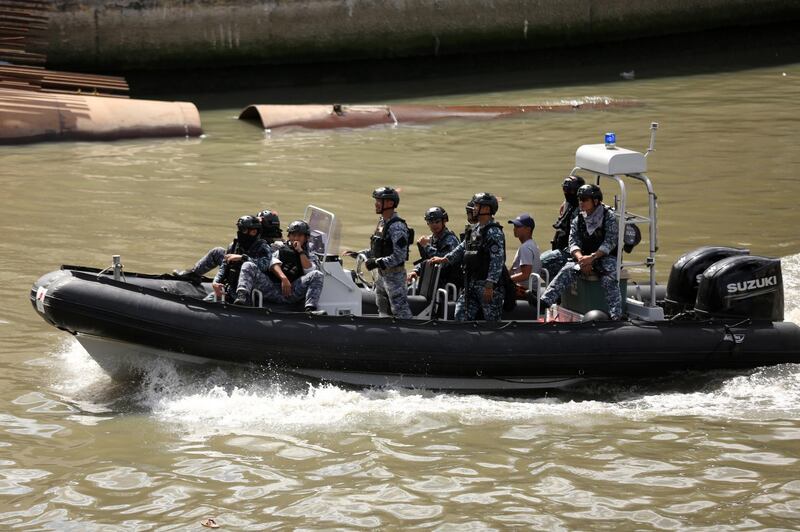 Philippine Coastguard personnel on a rigid inflatable boat conduct a patrol in the vicinity of the procession of the Black Nazarene. EPA