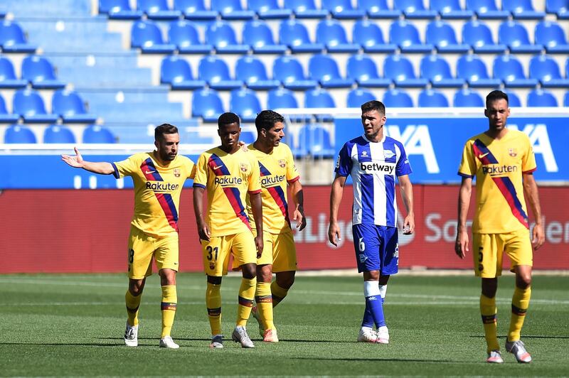 Barcelona forward Ansu Fati is congratulated by teammates after scoring the opening goal against Alaves. Getty Images