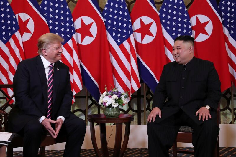 Donald Trump and Kim Jong-un sit down before their one-on-one talks. Reuters