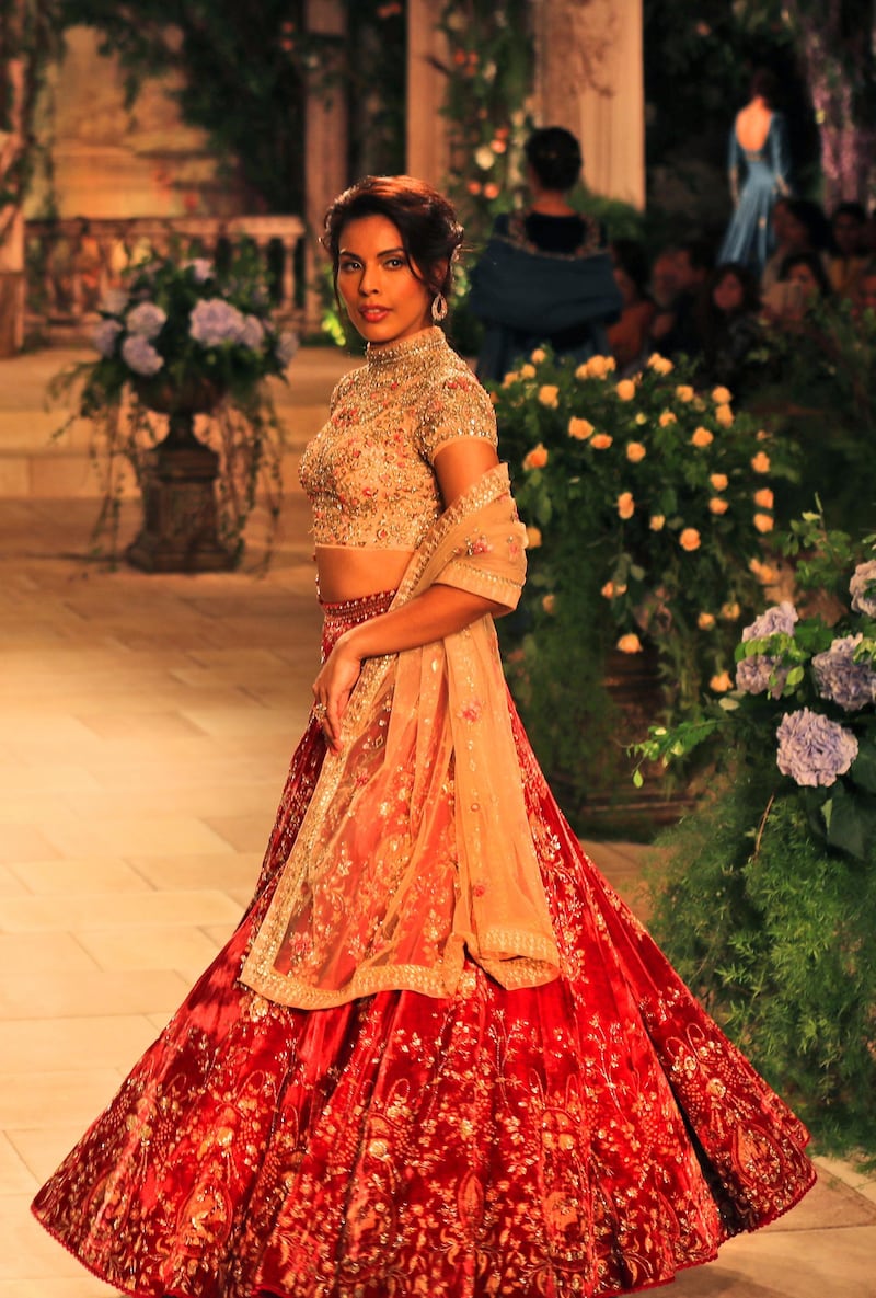 Anju Modi's women's line, meanwhile, included voluminous skirts and cropped tops with delicate net dupattas. AP