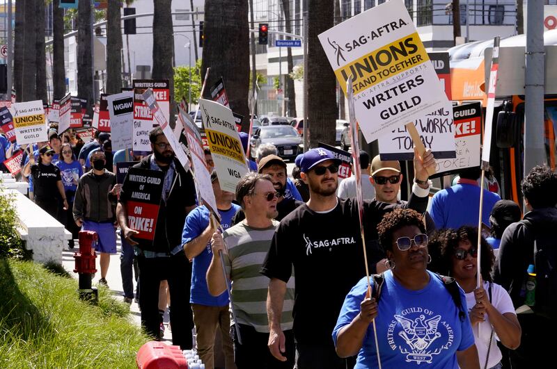 Members of the Screen Actors Guild - American Federation of Television and Radio Artists join a picket line in support of the Writers Guild of America outside the Netflix office on Sunset Boulevard. AP Photo 