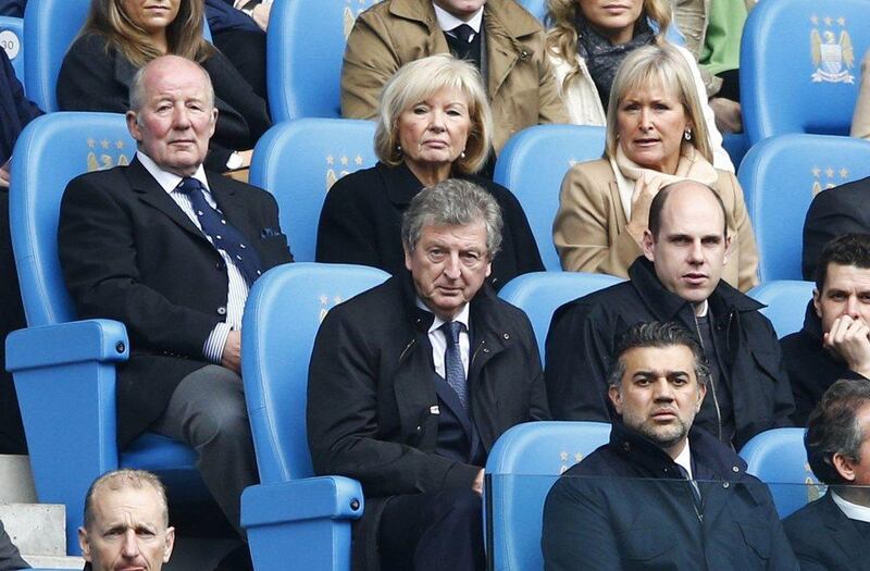 England manager Roy Hodgson, centre, watches Manchester City play Southampton during their Premier League match at the Etihad Stadium in Manchester Saturday. Darren Staples / Reuters / April 5, 2014   