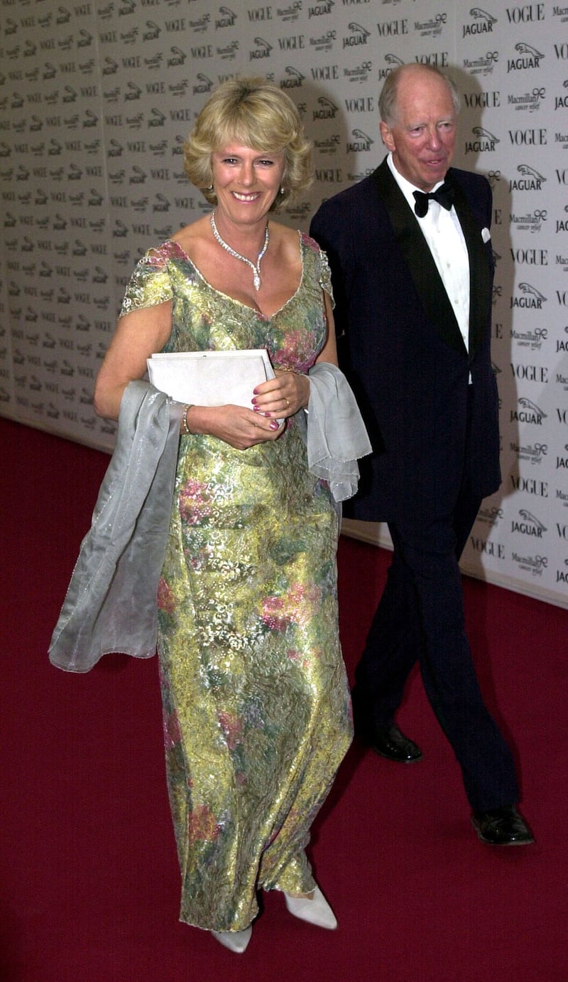 The queen consort in a green floral gown, arrives at the Vogue & Jaguar It's Fashion charity gala on June 11, 2001 in Buckinghamshire, England. Getty Images