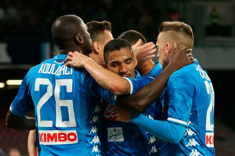 SSC Napoli's players celebrate after the team scored a goal against Genoas CFC during an Italian Serie A soccer match at the San Paolo stadium in Naples, Italy, Sunday, April 7, 2019. (Cesare Abbate/ANSA via AP)