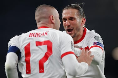 Turkey's forward Burak Yilmaz (left) celebrates with Turkey's defender Caner Erkin after scoring his second goal. AFP