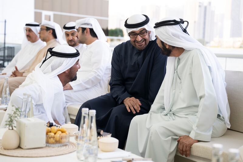 Sheikh Mohamed, Sheikh Mohammed bin Rashid and Sheikh Ahmed speak at the Sea Palace. Hamad Al Kaabi / Presidential Court