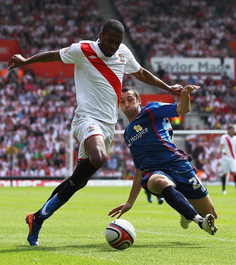 SOUTHAMPTON, ENGLAND - MAY 07:  Guly Do Prado of Southampton beats the tackle from Tom Williams of Walsall during the npower League One match between Southampton and Walsall at St Mary's Stadium on May 7, 2011 in Southampton, England.  (Photo by Matthew Lewis/Getty Images)