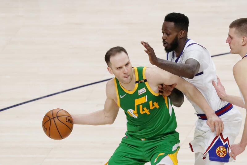 May 7, 2021; Salt Lake City, Utah, USA; Utah Jazz forward Bojan Bogdanovic (44) looks to pass the ball while defended by Denver Nuggets forward JaMychal Green (0) in the fourth quarter at Vivint Arena. Mandatory Credit: Rob Gray-USA TODAY Sports