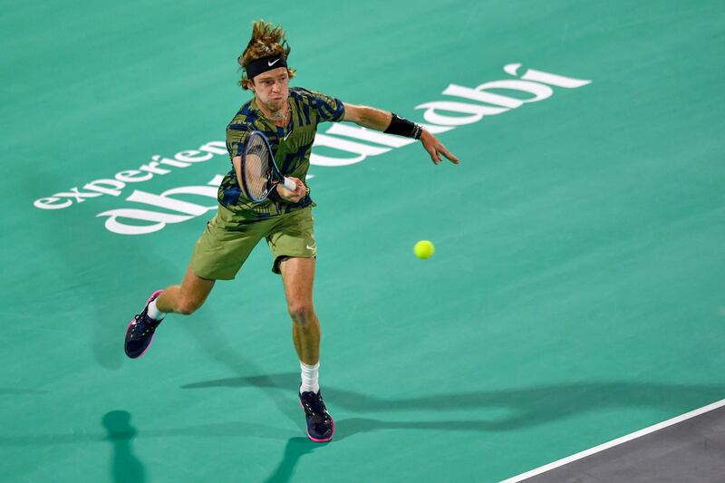Russia's Andrey Rublev returns the ball to Spain's Carlos Alcaraz during the semi-final of UAE's Mubadala World Tennis Championship, in Abu Dhabi on December 17, 2022.  (Photo by Ryan LIM  /  AFP)