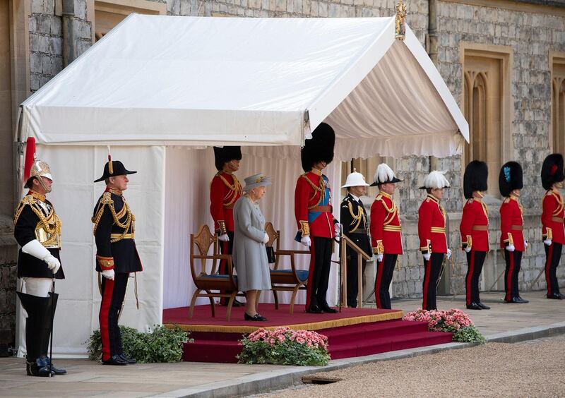 Britain's Queen Elizabeth II watches a military ceremony to mark her official birthday at Windsor Castle on June 12, 2021 in Windsor. AFP