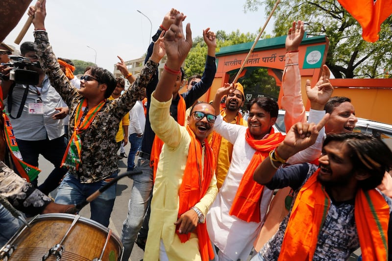 Bharatiya Janata Party (BJP) workers celebrate at BJP headquarters in, Lucknow, India. AP Photo