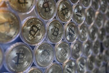 A physical imitation of a Bitcoin is displayed at a crypto currency shop in Istanbul. AFP