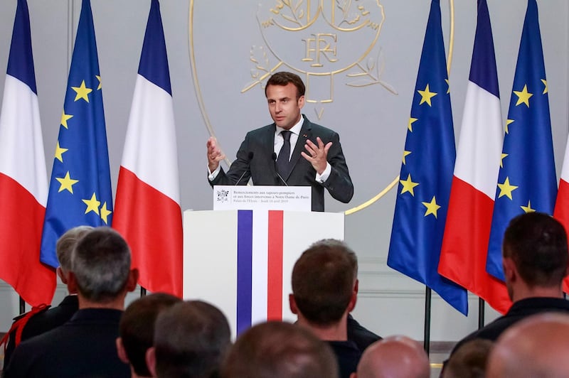 French President Emmanuel Macron addresses Paris Firefighters' brigade and security forces who took part at the fire extinguishing operations of the Notre Dame of Paris Cathedral fire, at the Elysee Palace in Paris, Thursday, April 18, 2019. France paid a daylong tribute Thursday to the Paris firefighters who saved the internationally revered Notre Dame Cathedral from collapse and rescued many of its treasures. AP