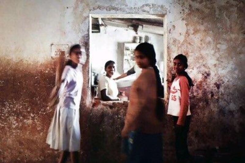 As dinner time approaches, residents and staff at Madilu gather around the kitchen.