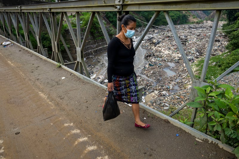 A bridge over the river in Chinautla, on the outskirts of Guatemala City. The Ocean Cleanup project faces unique seasonal challenges that include huge volumes of waste and high water pressure during the rainy season. AP Photo