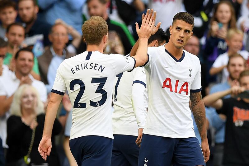 Erik Lamela celebrates with Danish midfielder Christian Eriksen after scoring Tottenham's fourth goal. AFP