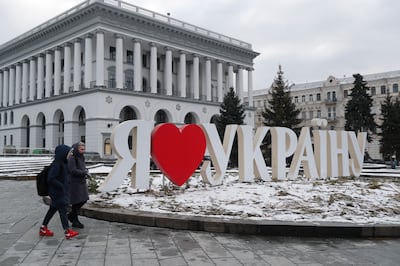 People walk past a lettering 'I love Ukraine' in the central square in Kiev. US and Britain announced withdrawal of some personnel from their embassies in Kiev, amid growing fears of a Russian invasion, on January 26. EPA