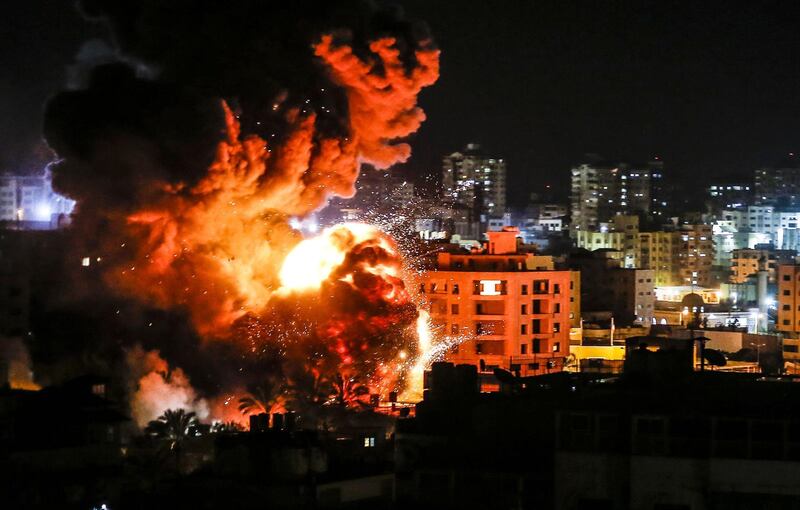 Fire and smoke billow above buildings in Gaza City during reported Israeli strikes. AFP