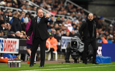 NEWCASTLE UPON TYNE, ENGLAND - DECEMBER 27:  Rafael Benitez, Manager of Newcastle United gives instructions with Josep Guardiola, Manager of Manchester City during the Premier League match between Newcastle United and Manchester City at St. James' Park on December 27, 2017 in Newcastle upon Tyne, England.  (Photo by Stu Forster/Getty Images)