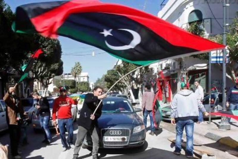 A man waves a Libyan flag during celebrations commemorating the second anniversary of the February 17 revolution in Tripoli. Ismail Zitouny / Reuters