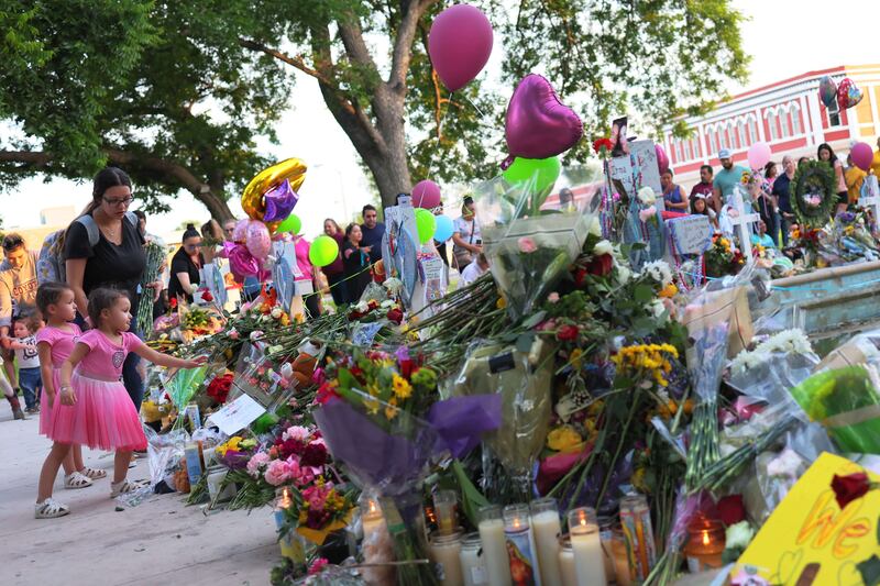 Flowers are left outside the school. AFP
