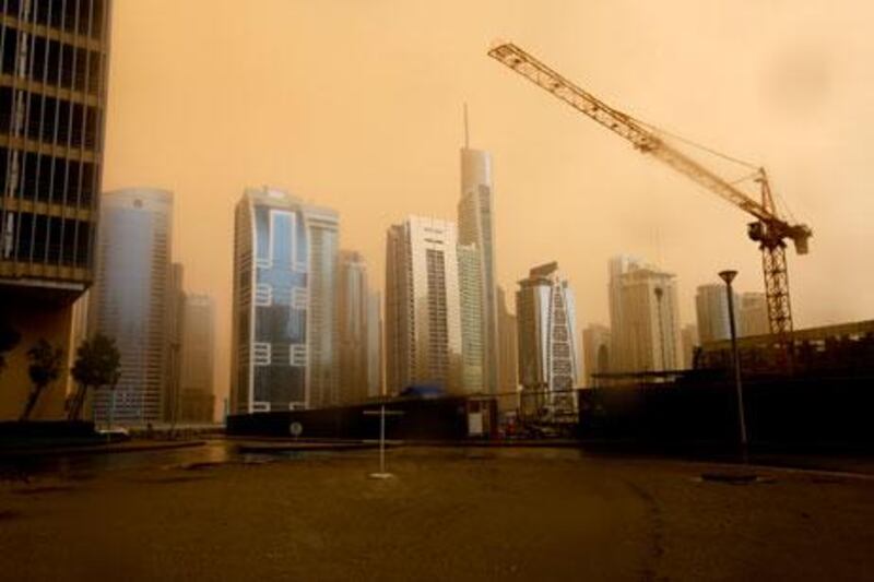 Dubai, April 7, 2013 - The sky took on an eerie orange cast during this morning's sandstorm over JLT in Dubai, April 7, 2013. (Photo by: Sarah Dea/The National)