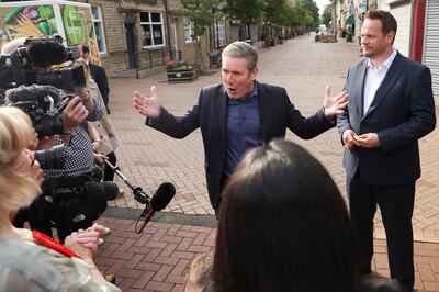 Labour Party leader Keir Starmer speaks with members of the media, as he meets with newly elected MP Simon Lightwood after his victory in the Wakefield by-election. Reuters