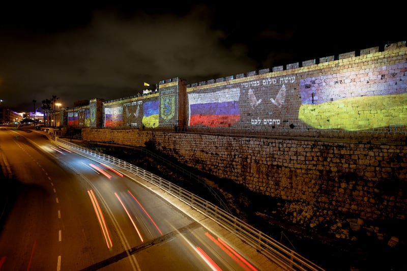 The flags of Russia and Ukraine are projected on the walls of Jerusalem's Old City, which a representative from the Jerusalem Municipality said is a show of support for diplomatic dialogue between the countries. Reuters